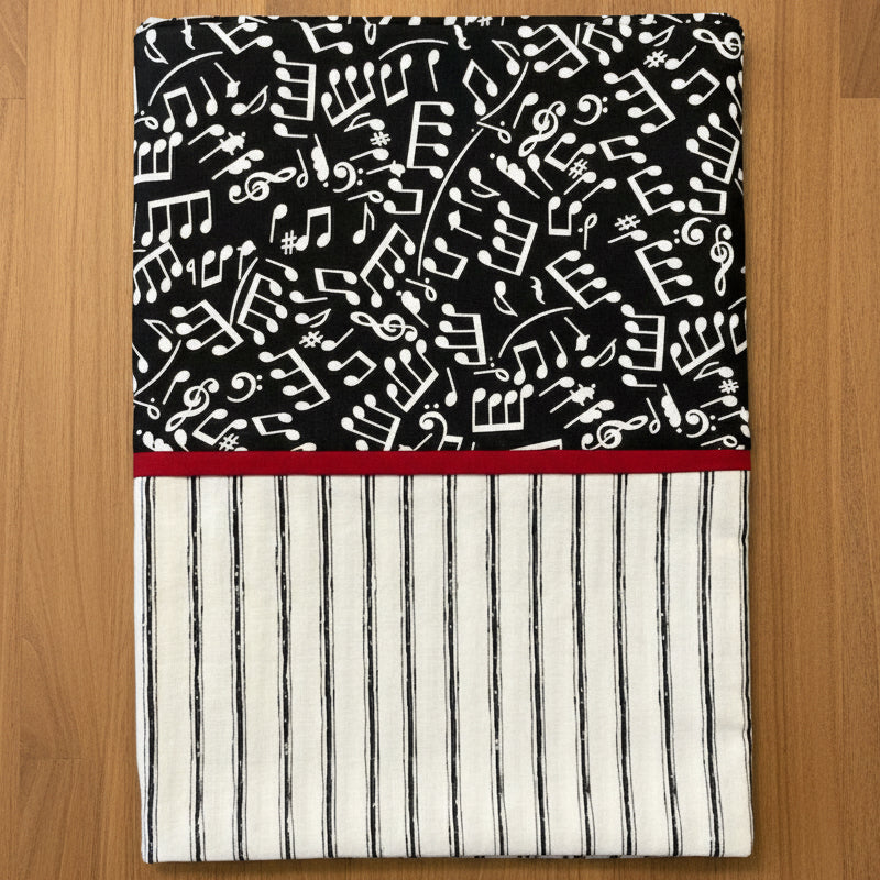 Pillowcase musical note pattern on black background and striped pattern at bottom