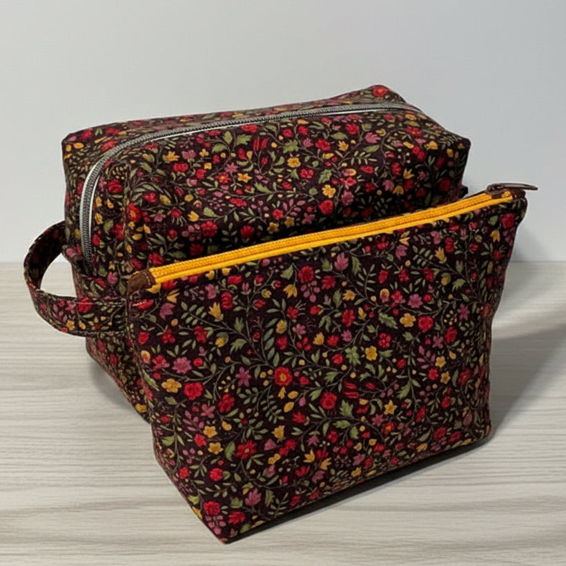 Two floral-patterned bags with zipper closures 