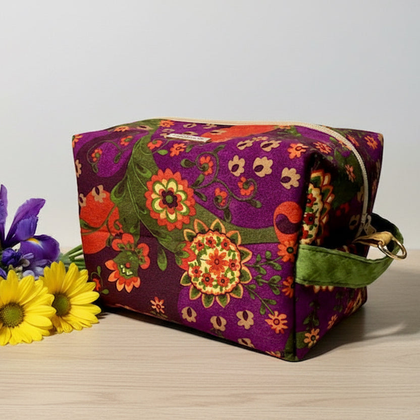 Floral patterned bag with a purple background 