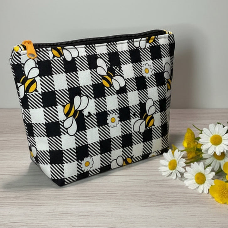 Plaid pouch with bee and flower pattern 