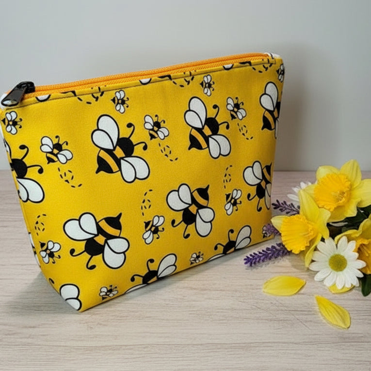 Yellow pouch with bee pattern 