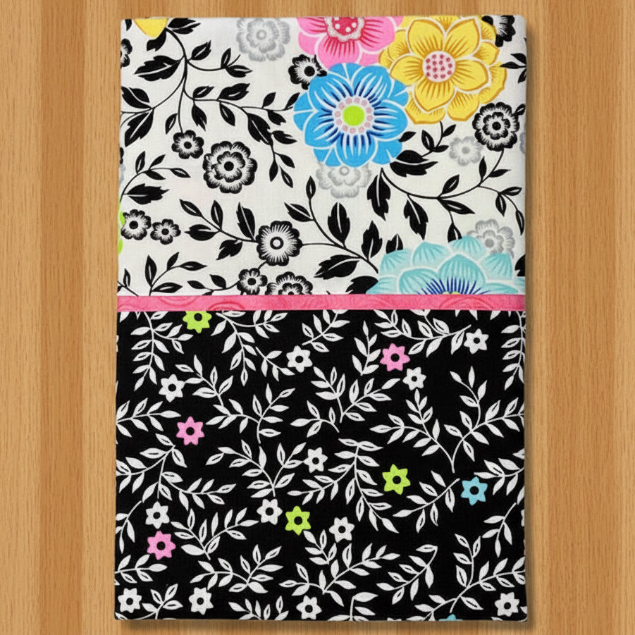 Pillowcase  with black, white, and colorful flowers 