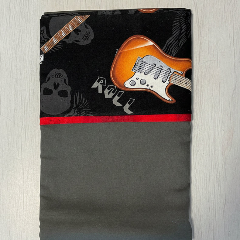 Pillowcase with guitar design and 'Roll' text on a black background