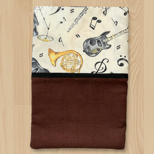 Pillowcase with musical instrument pattern and brown border