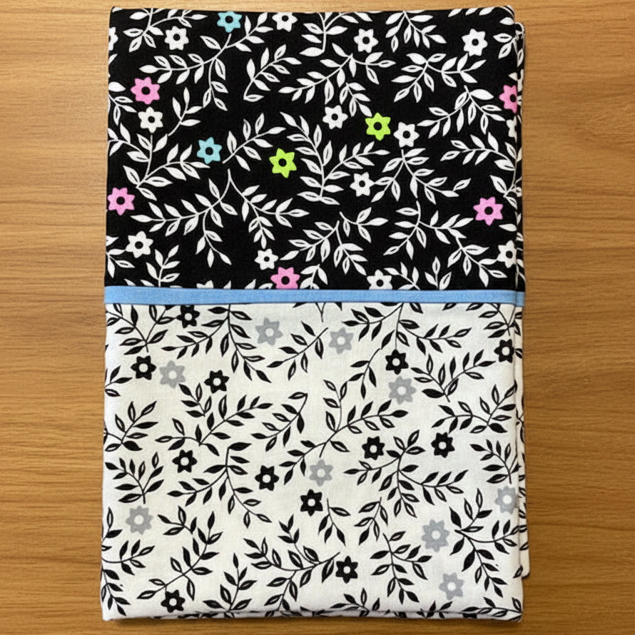 Pillowcase with black, white, pink, and green colors 