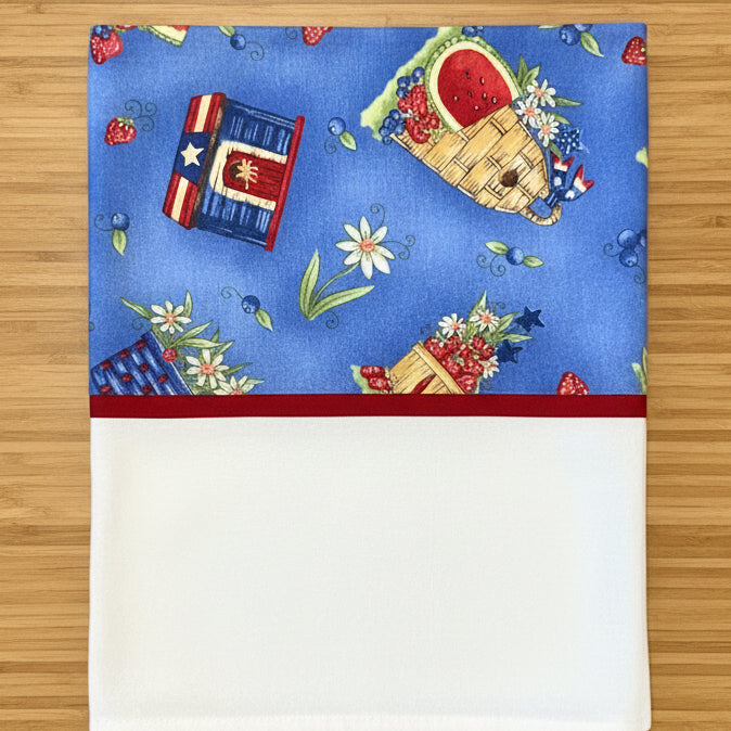 Pillowcase with patriotic design featuring books, baskets, and flowers 