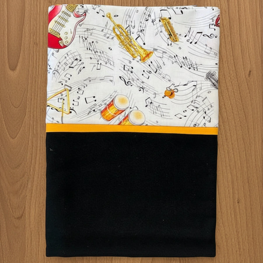 Pillowcase with musical instrument and note pattern on a white background