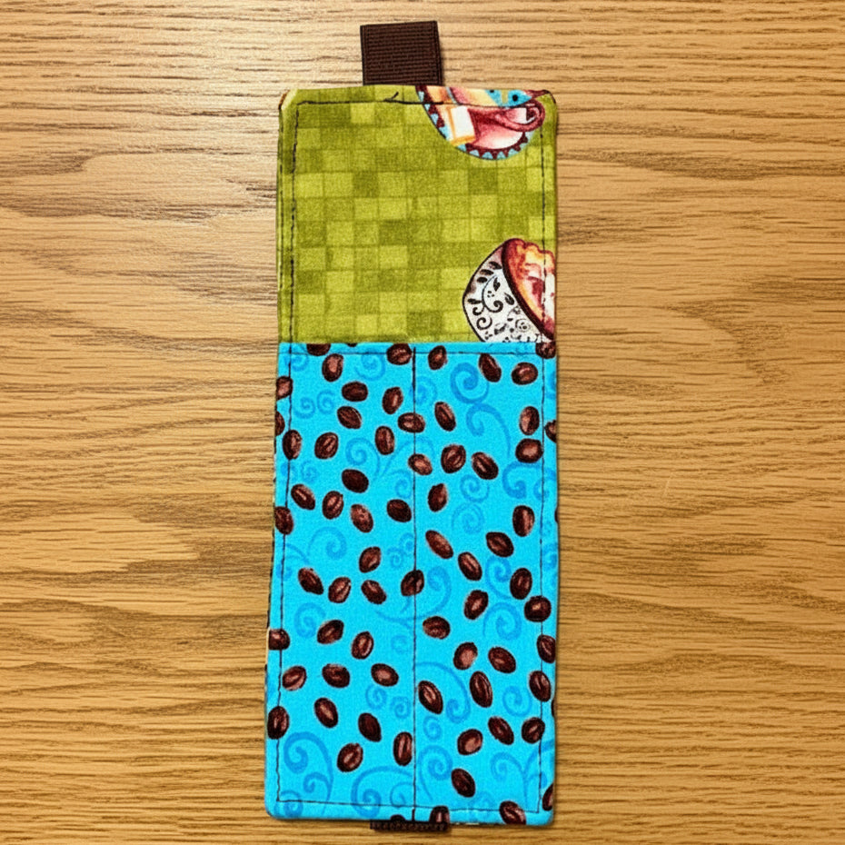 Fabric bookmark with green top and blue bottom with brown pattern 
