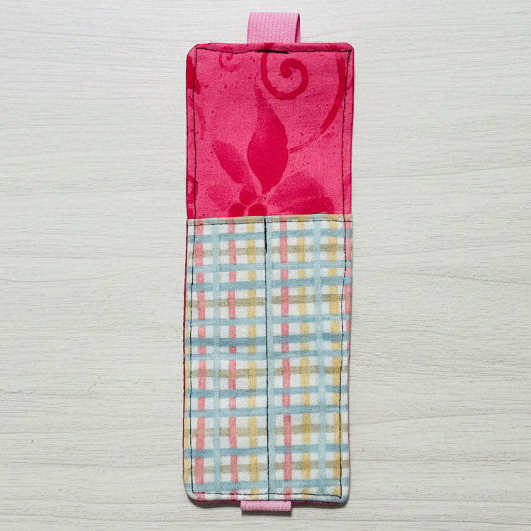 Two fabric pouches with different patterns on a light gray background